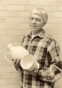 Dennis Frandrup holding pottery